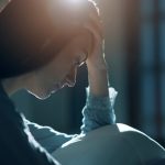 Sad woman suffering from insomnia in her bed Blue Monday depresja